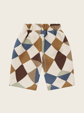 將圖片載入圖庫檢視器 Geometric patterned pants on a beige background