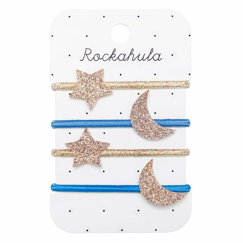Set of four hair clips with star and moon designs on a Rockahula branded card.