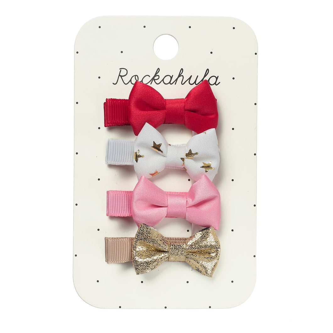 Set of colorful bow hair clips on a Rockahula branded card.
