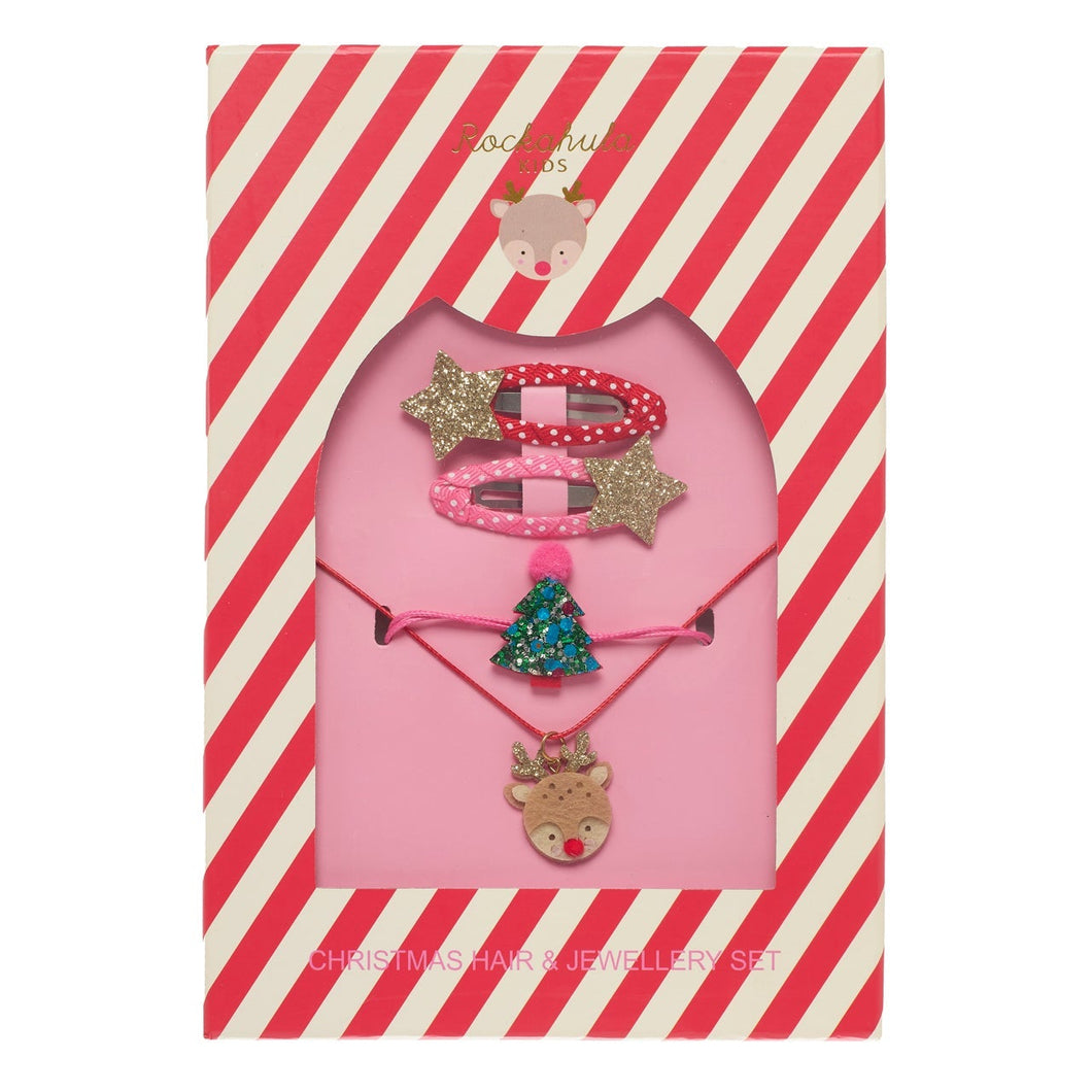 Set of Christmas-themed hair accessories including a headband, necklace, and earrings on a red and white striped background.