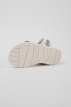 Load image into Gallery viewer, White sandal with colorful accents on a light gray background