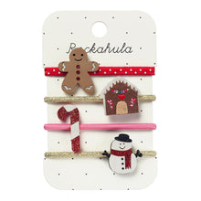 Load image into Gallery viewer, Set of Christmas-themed hair elastics on a &#39;Rockahula&#39; branded card.
