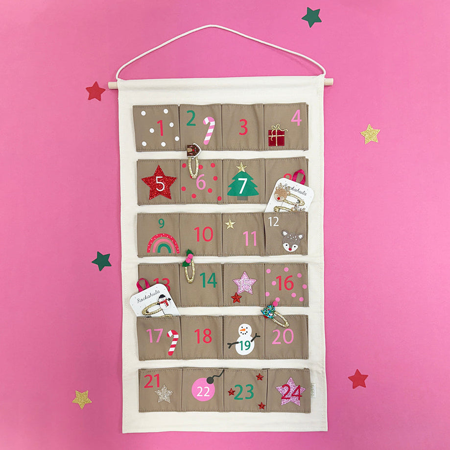 Advent calendar with cartoon designs on a pink background