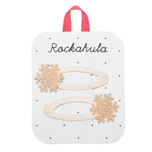 Set of hair accessories on a Rockahula branded card with a pink handle.