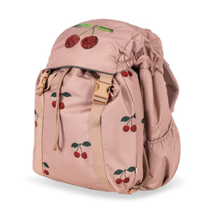 Pink backpack with cherry designs on a white background