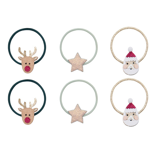 Set of Christmas-themed hair ties with reindeer, star, and Santa Claus designs on a white background.