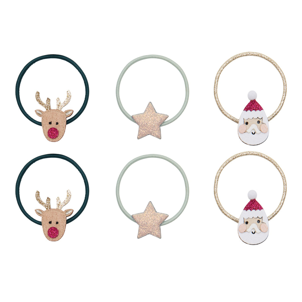 Set of Christmas-themed hair ties with reindeer, star, and Santa Claus designs on a white background.