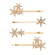 Load image into Gallery viewer, Set of gold hair pins with star designs on a white background