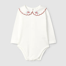 Load image into Gallery viewer, White baby bodysuit with floral collar on a light gray background
