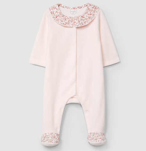Pink baby onesie with floral details on a light gray background