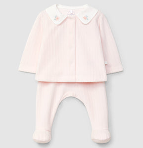 Pink baby outfit with jacket and pants on a light gray background
