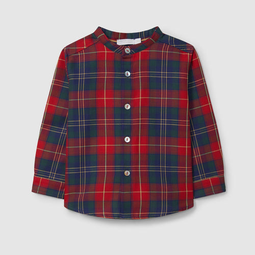 Red and blue plaid shirt on a light gray background