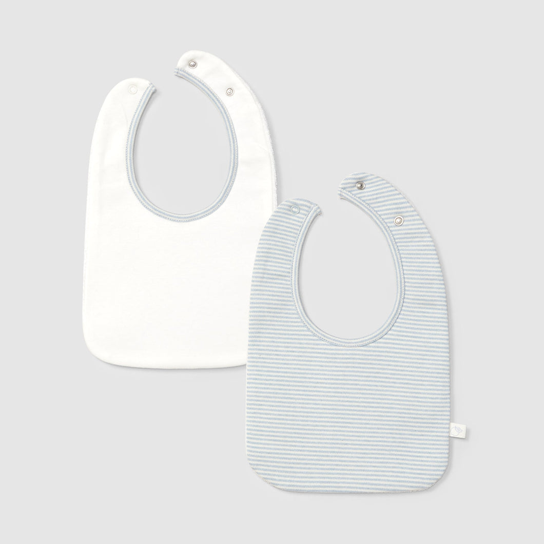 Two baby bibs, one plain white and one with a subtle pattern, on a light gray background.