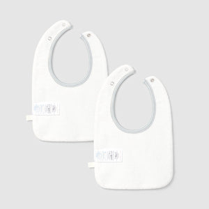 Two white baby bibs on a light gray background