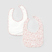 Load image into Gallery viewer, Two baby bibs with floral pattern on a light gray background