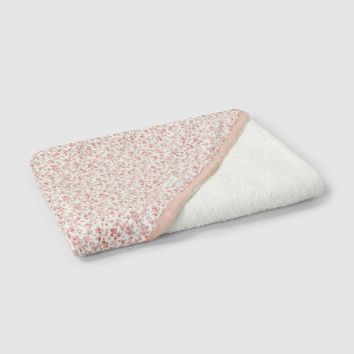 Floral-patterned baby blanket on a light gray background