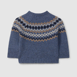 Blue knitted sweater with a pattern on the back against a light gray background