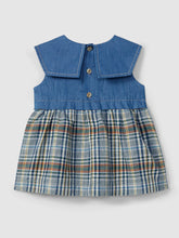 Load image into Gallery viewer, Check denim dress in indigo by Laranjinha, featuring a casual fit and classic denim fabric, displayed on a hanger.