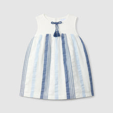 Load image into Gallery viewer, White dress with blue striped pattern and bow detail on a light gray background