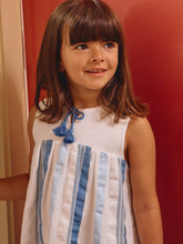 Load image into Gallery viewer, Laranjinha white striped textured fabric dress displayed on a hanger with a simple background.