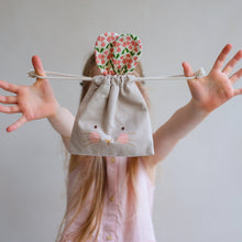 Load image into Gallery viewer, Pink Easter pouch headband by MIMI &amp; LULA with soft fabric and playful design, perfect for festive spring accessories.