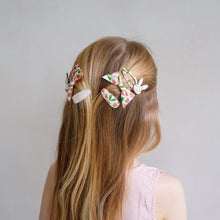 Load image into Gallery viewer, Pink Easter pouch headband by MIMI &amp; LULA with festive design, perfect for spring celebrations and holiday accessories.