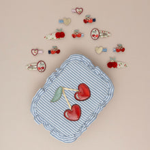 Load image into Gallery viewer, Striped cherry headband by MIMI &amp; LULA featuring red and white stripes with cherry accents, displayed on a jewelry box.