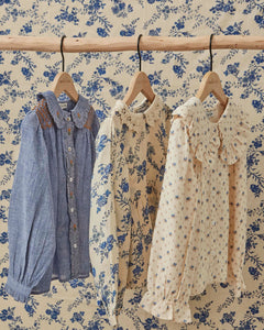 Ecru blouse with blue flowers
