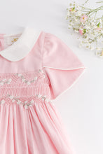 Load image into Gallery viewer, Kidiwi Clémence smocked dress in Fairy Tale pink poplin, featuring a fitted bodice and flowing skirt, perfect for special occasions.