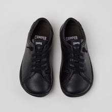 Load image into Gallery viewer, Pair of black sneakers on a light gray background