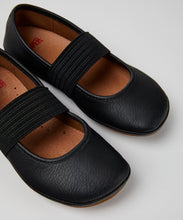 Load image into Gallery viewer, Black shoes with elastic straps on a light gray background