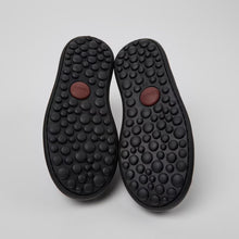 Load image into Gallery viewer, Pair of black textured insoles on a light gray background