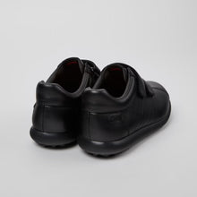 Load image into Gallery viewer, Black shoes on a light gray background