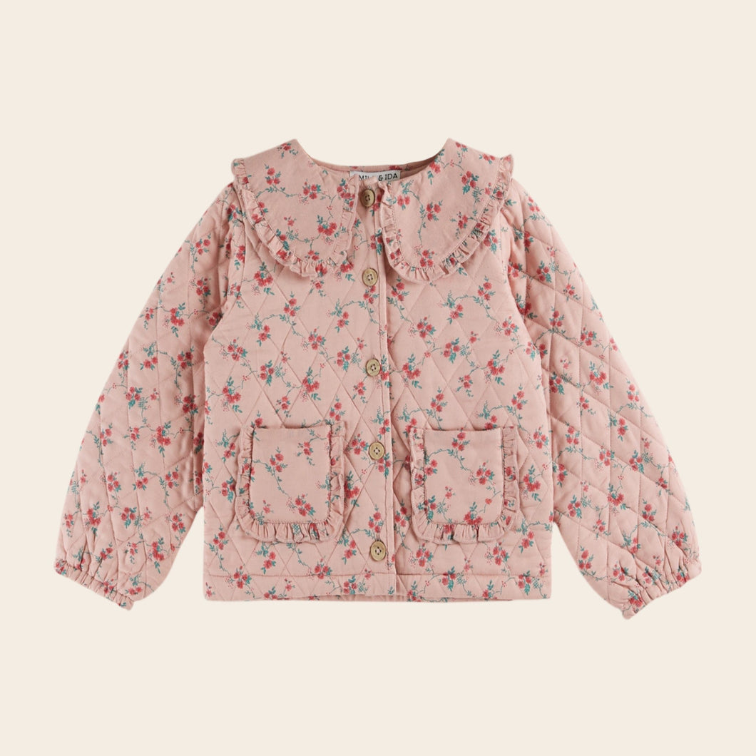 Pink floral jacket on a beige background