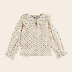 Floral blouse on a beige background