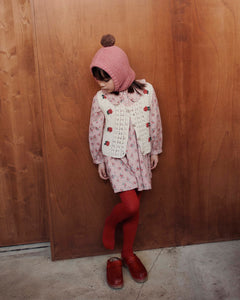 Loose-fitting pink dress with red flowers