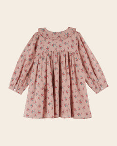 Loose-fitting pink dress with red flowers