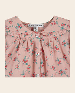 Pink blouse with red flowers