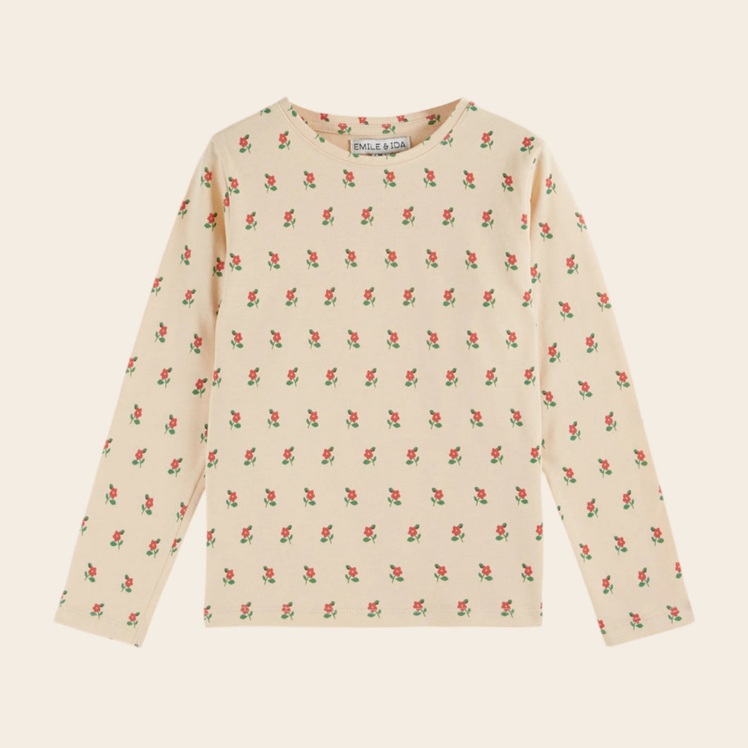 Long-sleeve shirt with floral pattern on a beige background