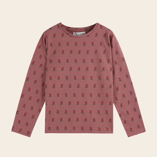 Pink long-sleeve shirt with small pattern on a beige background