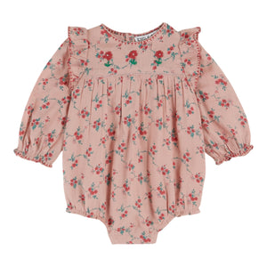 Pink floral baby romper on a white background