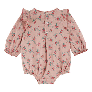 Pink floral baby romper on a white background