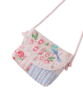 Load image into Gallery viewer, Gingersnaps Kane patchwork sling bag with embroidered patches, showcasing its stylish design and adjustable strap.