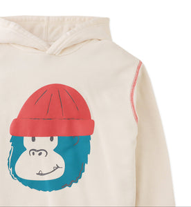 Beige hoodie with a cartoon monkey design on a white background