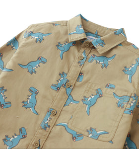 Beige shirt with blue dinosaur pattern on a white background