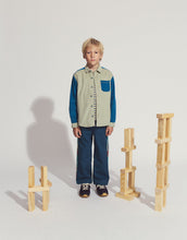 Load image into Gallery viewer, Child standing next to wooden搭建 blocks on a plain background