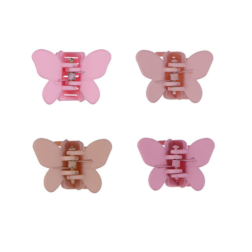 Four pink butterfly-shaped hair clips on a white background