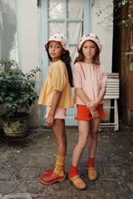 Load image into Gallery viewer, Ecru strawberry crochet hat by Emile et Ida featuring a soft, textured design perfect for stylish warmth.