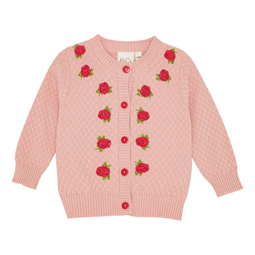Pink cardigan with rose patterns on a white background
