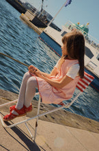 將圖片載入圖庫檢視器 Young girl wearing a colorful dress with a patterned jacket on a beige background